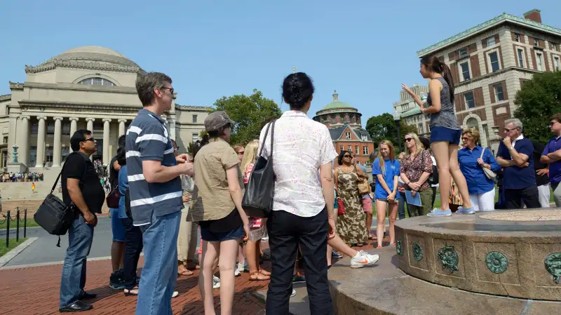 A student leader gives an admissions tour in the center of campus, Columbia University, August 8, 2014.