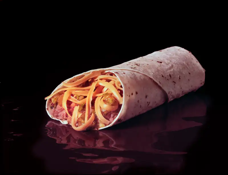 A Burrito On Black Background