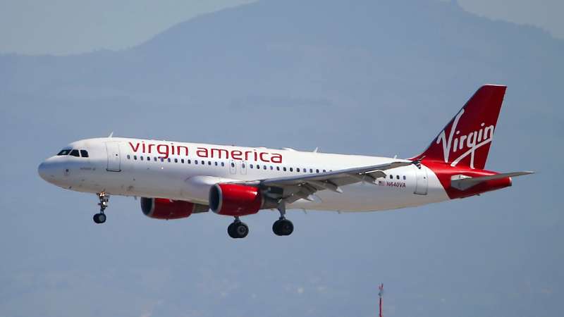 A Virgin America plane lands at San Francisco International Airport on March 29, 2016 in Burlingame, California. JetBlue Airways and Alaska Air Group are reportedly preparing takeover offer bids for Virgin America airlines.