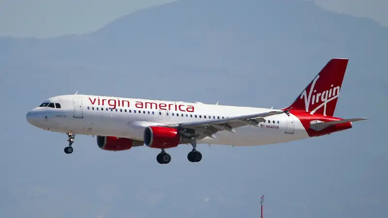 A Virgin America plane lands at San Francisco International Airport on March 29, 2016 in Burlingame, California. JetBlue Airways and Alaska Air Group are reportedly preparing takeover offer bids for Virgin America airlines.