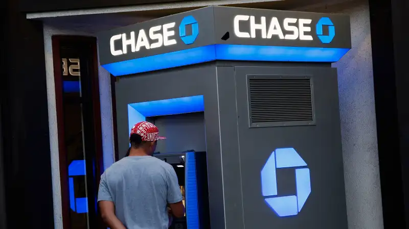 Customers use a JPMorgan Chase &amp; Co. bank ATM in the Little Tokyo neighborhood of Los Angeles, on July 7, 2015.