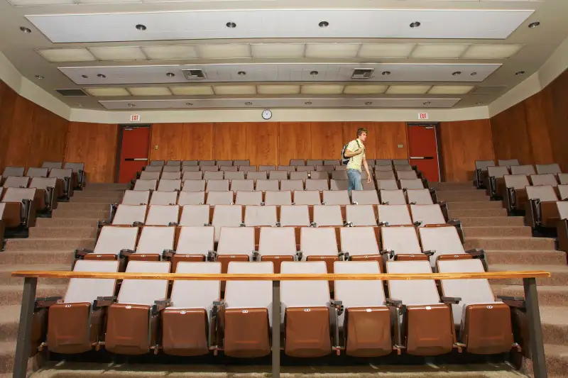 student walking out of classroom