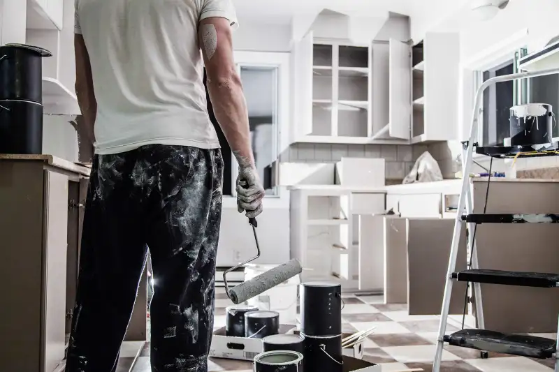 man renovating kitchen