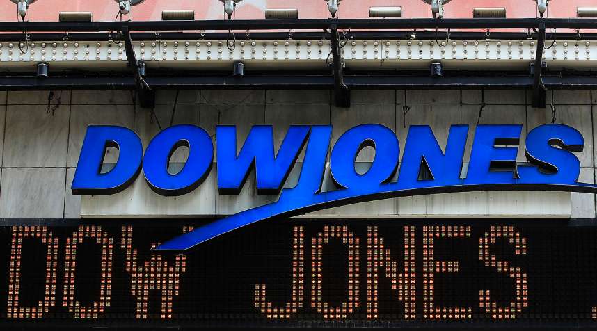 The Dow Jones financial electronic ticker is seen at Times Square in New York July 17, 2012.
