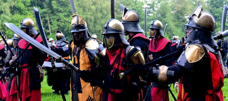 Participants in the live action role playing game 'ConQuest of Mythodea' fight on a battle field near Brokeloh, Germany, 07 August 2014. Around 8,000 of them assembled for the live action role-playing game (LARP) ehich is scheduled to last five days.