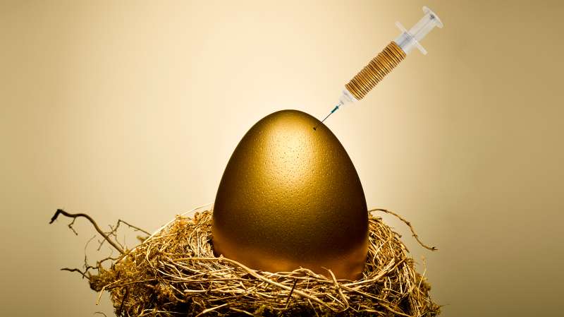 syringe in gold egg