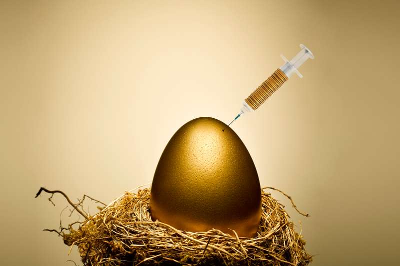 syringe in gold egg