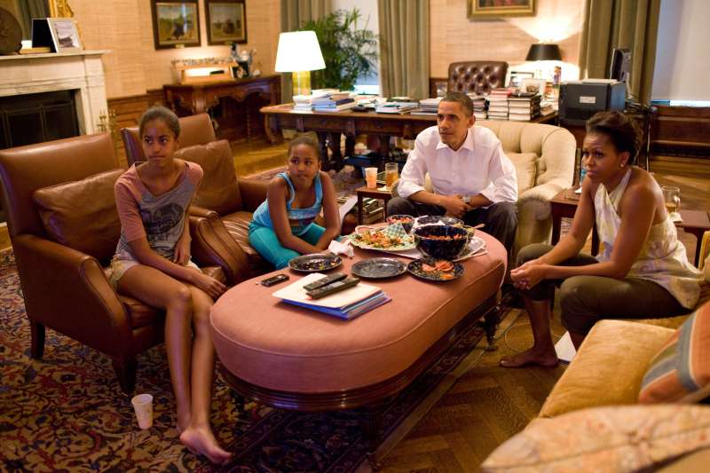 President Barack Obama and his daughters Sasha and Malia watch the World Cup soccer game.
