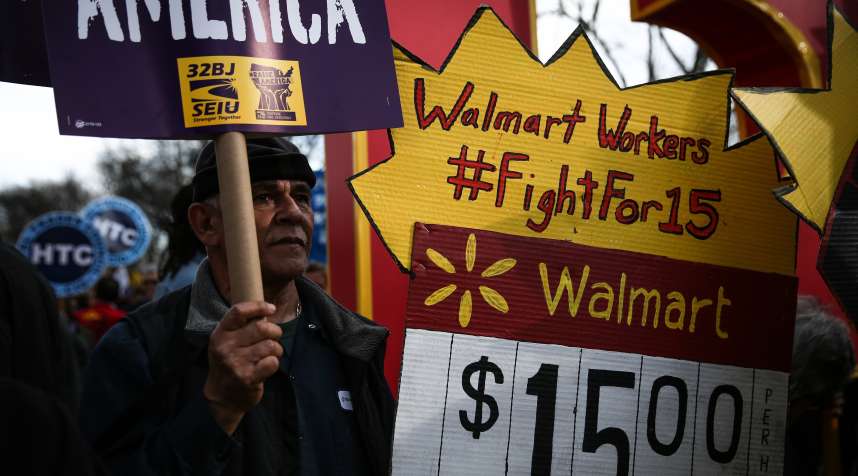 NEW YORK, UNITED STATES - APRIL 15: A national movement 'Fight For $15' including workers and labor unions march to raise the minimum wage to $15/hour, at Colombus Square.
