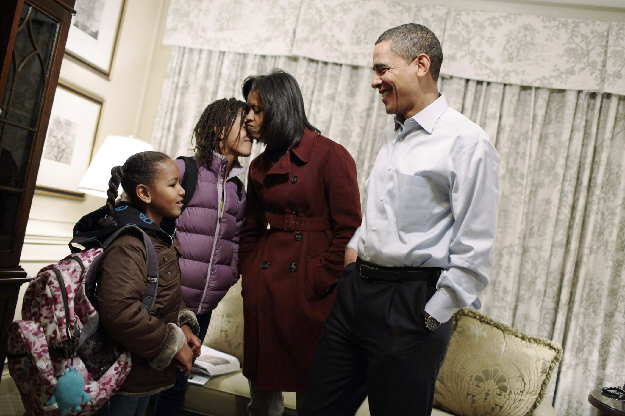 U.S. President elect Barack Obama and Michelle Obama get their daughters Sasha (L) and Malia (second from left) ready for their first day of school at Sidwell Friends in Washington January 5, 2009. The Obama family is staying at the Hay Adams Hotel in Washington until they move to Blair House, and then to the White House on January 20, 2009.