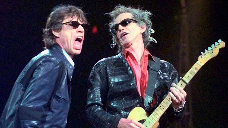 In this Monday, March 22, 1999, file photo, Mick Jagger, left, and Keith Richards perform  Jumping Jack Flash  during the Rolling Stones' No Security Tour performance at the Fleet Center in Boston. Goldenvoice Entertainment, a subsidiary of AEG Live, announced Tuesday, May 3, 2016, that Paul McCartney, The Rolling Stones, Roger Waters, Neil Young, The Who and Bob Dylan will perform for Desert Trip, during a three-day concert, Oct. 7-9, 2016, at the desert grounds where the annual Coachella Valley Music and Arts festival is held in Indio, Calif.