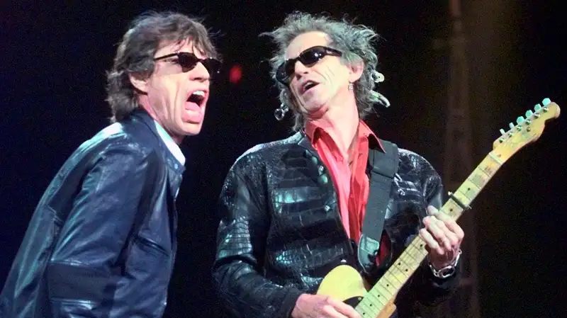 In this Monday, March 22, 1999, file photo, Mick Jagger, left, and Keith Richards perform Jumping Jack Flash during the Rolling Stones' No Security Tour performance at the Fleet Center in Boston. Goldenvoice Entertainment, a subsidiary of AEG Live, announced Tuesday, May 3, 2016, that Paul McCartney, The Rolling Stones, Roger Waters, Neil Young, The Who and Bob Dylan will perform for Desert Trip, during a three-day concert, Oct. 7-9, 2016, at the desert grounds where the annual Coachella Valley Music and Arts festival is held in Indio, Calif.