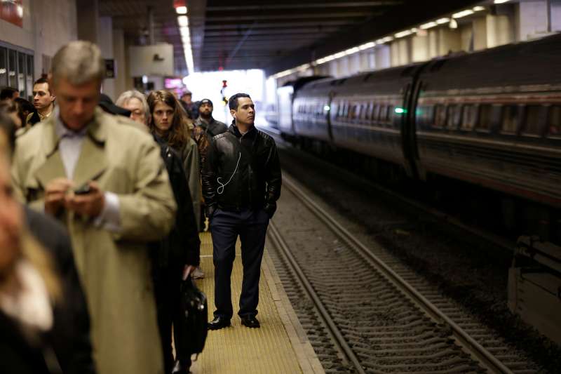 Commuters wait to board NJ Transit trains heading to New York City at a train station in Secaucus, N.J., March 14, 2016.