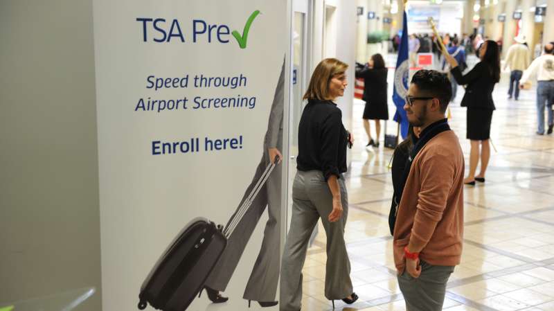 A poster announcing the Transportation Security Administration's (TSA) new Precheck program is seen outside the PreCheck enrollment office, at Los Angeles International Airport (LAX) on February 20, 2014 in Los Angeles, California. The TSA recently launched the PreCheck program that allows those enrolled in a trusted traveler network to enter about 100 US airports through a special security lane where they dont have to take off shoes, belts and jackets or remove laptops, liquids or gels.