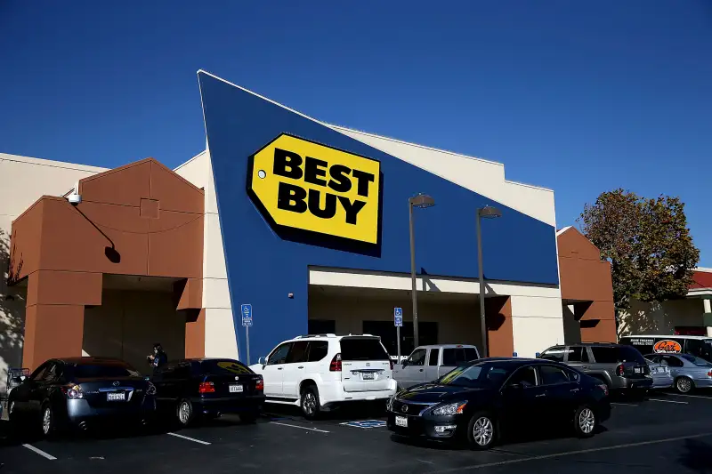 A car drives by a Best Buy store on November 19, 2015 in San Bruno, California.