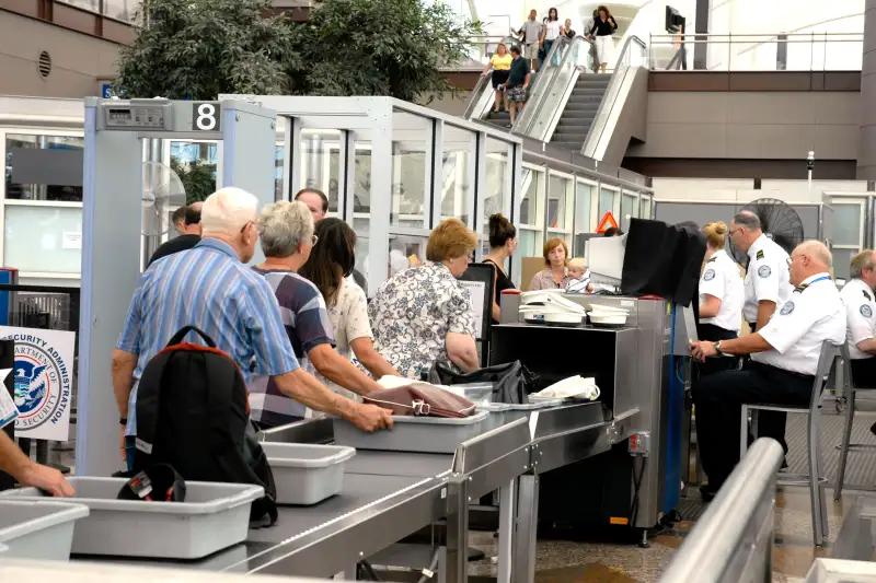 People wait in security line at Denver airport