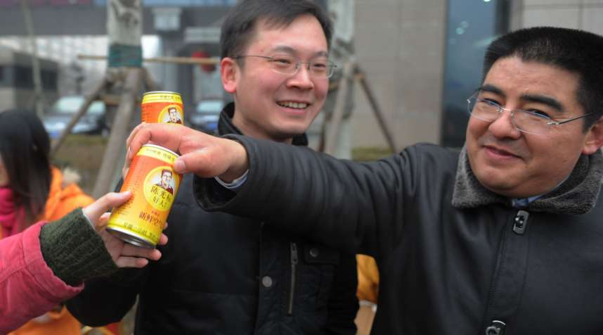 Chen Guangbiao, Chairman of Jiangsu Huangpu Recycling Resources Co., presents his company's product canned fresh air at Beijing Financial Street on January 30, 2013 in Beijing, China.