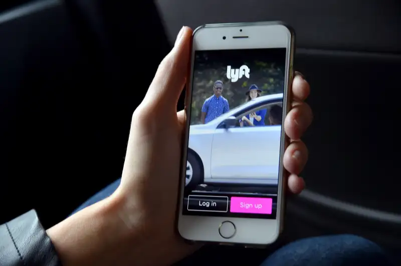 Lyft At Its San Francisco Headquarters Showcasing Lyft Cars, The Glowstache, The Lyft App, Lyft Passengers And Drivers