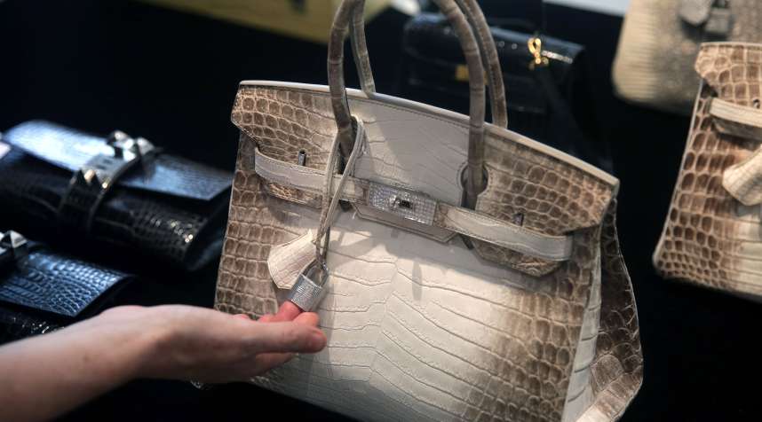 A Matte White Himalaya Niloticus Crocodile Diamond Birkin with 18K gold and diamond hardware -- one of the most valuable handbags in the world -- sits on display during a preview at Christies in Hong Kong on May 4, 2016.