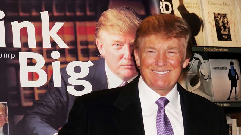 Donald Trump gestures as he poses for a photo during an in-store appearance to sign copies of  How To Build Wealth,  which is a series of nine audio business courses created by Trump University, at a Barnes & Noble store January 10, 2005 in New York City.