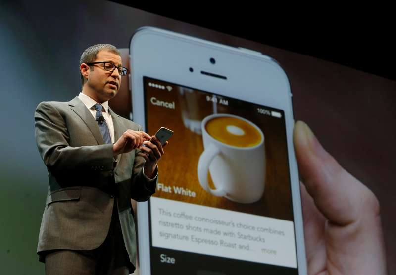 In this March 18, 2015 file photo, Adam Brotman, Starbucks chief digital officer, talks about the company's mobile ordering app at Starbucks Coffee Company's annual shareholders meeting in Seattle.