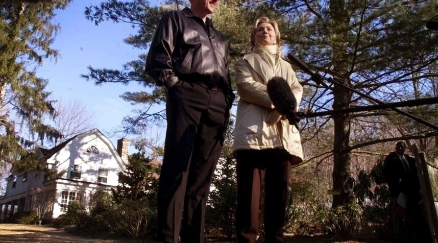 Hillary Rodham Clinton and President Bill Clinton stand in the driveway of their $1.7 million Chappaqua, N.Y., residence after spending their first night in the house, January 6, 2000.