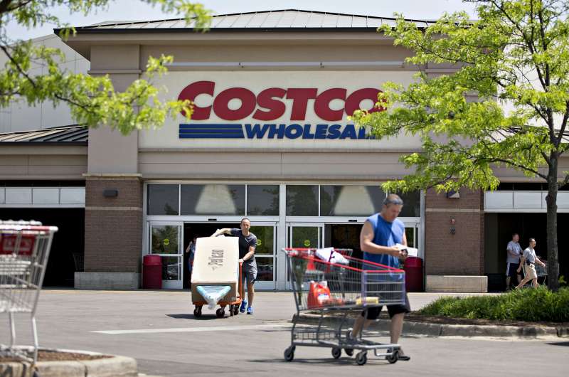 Customers exit a Costco Wholesale Corp. store in Naperville, Illinois, on May 23, 2016.