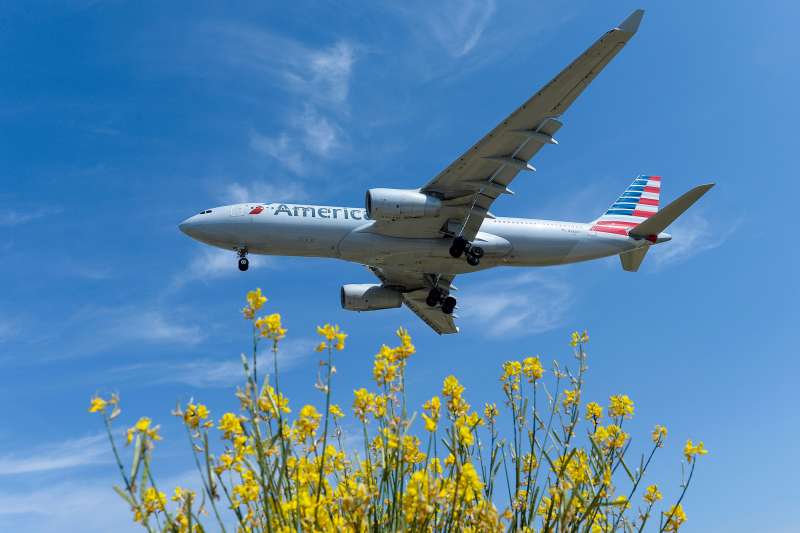 An airplane of the US airline American Airlines prepares to land at Barcelona's airport in El Prat de Llobregat on June 6, 2016.