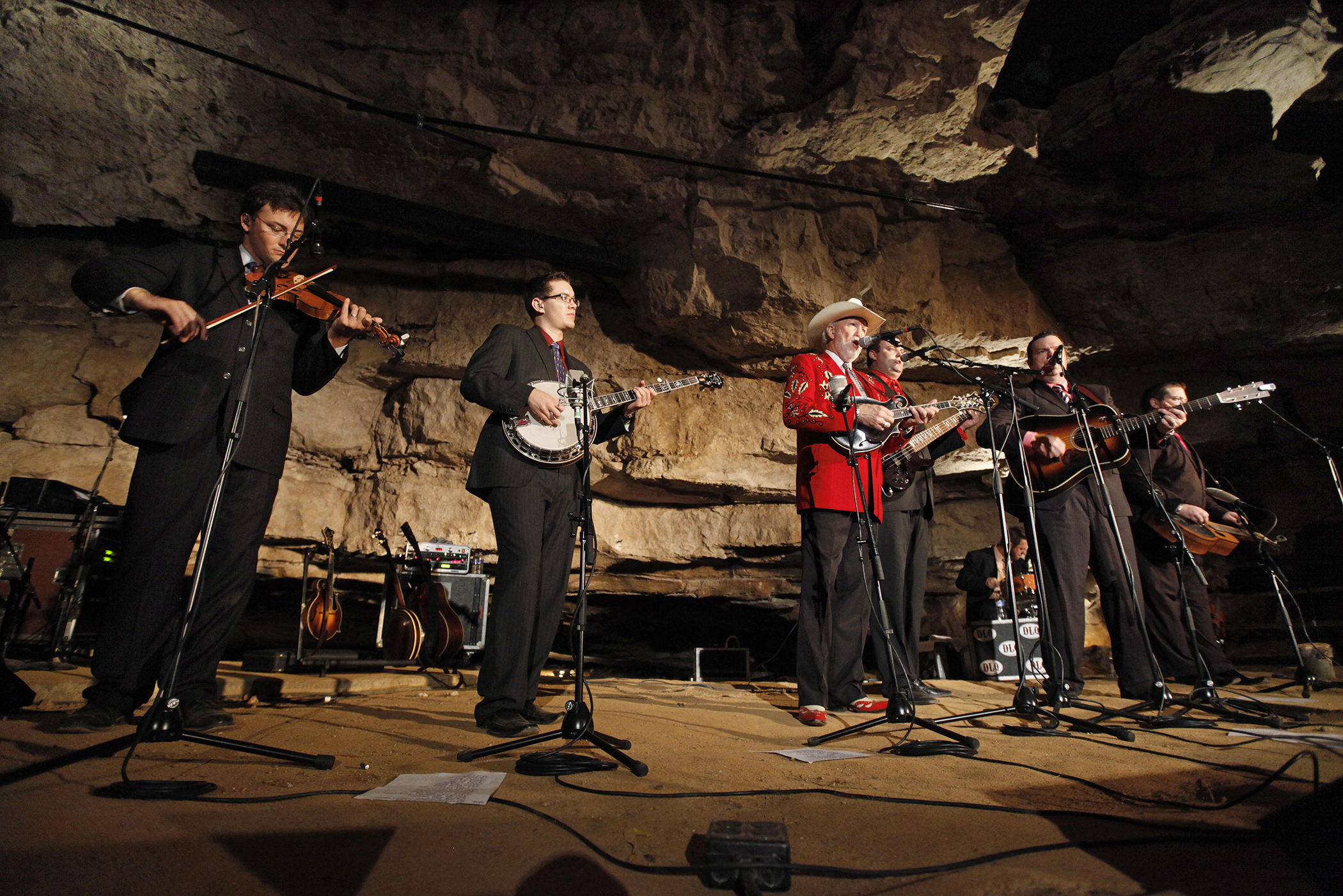 In this July 26, 2011 photo, Doyle Lawson, center, and Quicksilver perform in the Volcano Room at Cumberland Caverns, 333 feet below ground, in McMinnville, Tenn. The natural ampitheater is where the Bluegrass Underground radio show is broadcast from once a month.