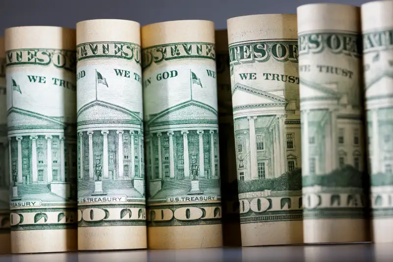 Dollar bills standing on a table on February 15, 2016, in Berlin, Germany.