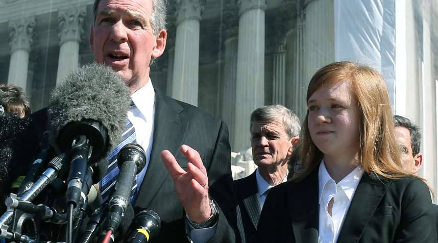 Abigail Fisher stands beside her attorney outside the U.S. Supreme Court in, 2012, when her case first was heard by the high court. On Thursday, the court ruled against Fisher, saying the university's consideration of race in admissions is constitutional.  (Photo by Mark Wilson/Getty Images)