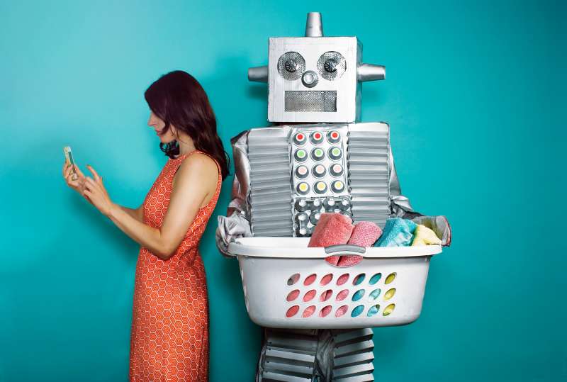Woman Texting Standing By Robot