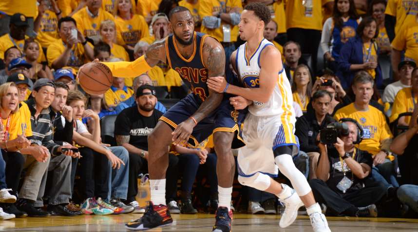 LeBron James of the Cleveland Cavaliers handles the basketball against Stephen Curry of the Golden State Warriors during Game Five of the 2015 NBA Finals.