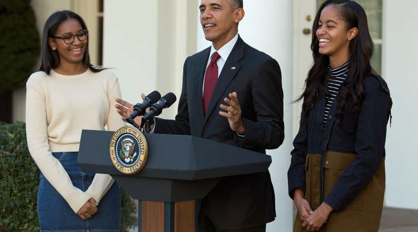 President Obama with Sasha (L) and Malia.