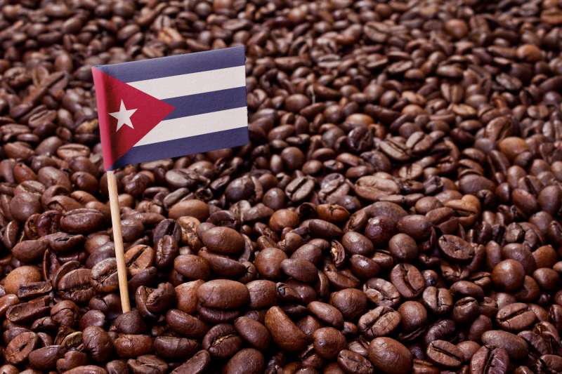 Flag of Cuba sticking in coffee beans.(series)