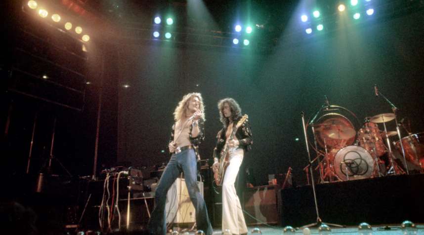Singer Robert Plant and guitarist Jimmy Page of the rock band  Led Zeppelin  perform onstage at the Forum on June 26, 1977 in Los Angeles, California.