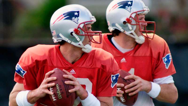 New England Patriots quarterbacks Tom Brady (L) and Drew Bledsoe drop back together during passing drills at a team practice at Tulane University in New Orleans Louisiana, January 30, 2002. Patriots Head Coach Bill Belichick was expected to announce which quarterback will start Superbowl XXXVI against the St. Louis Rams after the practice.