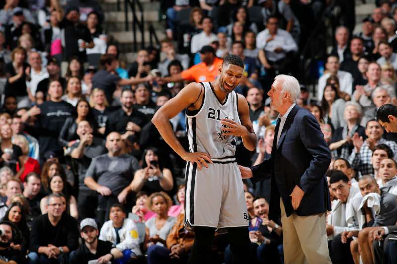 Tim Duncan #21 of the San Antonio Spurs talks with Head Coach Gregg Popovich of the San Antonio Spurs during the game against the Golden State Warriors on March 19, 2016 at the AT&T Center in San Antonio, Texas.