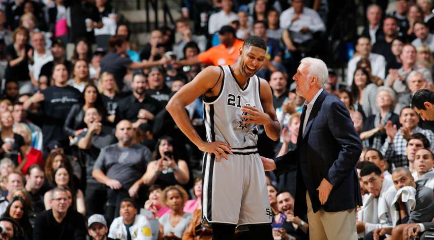 Tim Duncan of the San Antonio Spurs and coach Gregg Popovich.