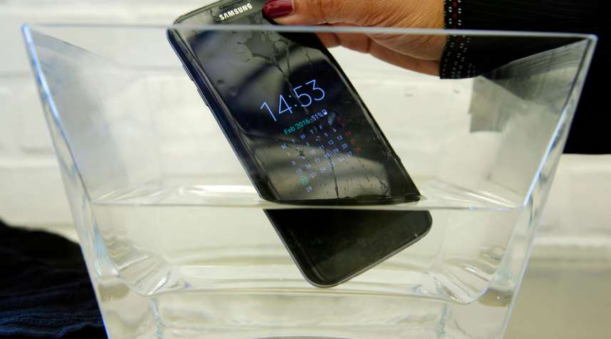 In this Feb. 22, 2016, file photo, a waterproof Samsung Galaxy S7 Edge mobile phone is submersed in water during a preview of Samsung's flagship store, Samsung 837, in New York's Meatpacking District. Consumer Reports says Samsung’s Galaxy S7 Active malfunctions in water despite being marketed as water resistant, though the regular S7 and S7 Edge models passed. Consumer Reports rates the S7 and S7 Edge phones as “Excellent” and the Active likely would have joined them. Instead, Consumer Reports isn’t recommending the model because two phones failed after being submerged in water.