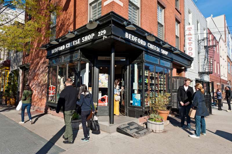 A cheese shop occupying a prime corner spot in a trendy part of New York's Brookyln.