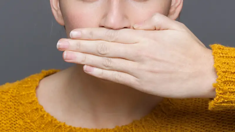 hand covering mouth