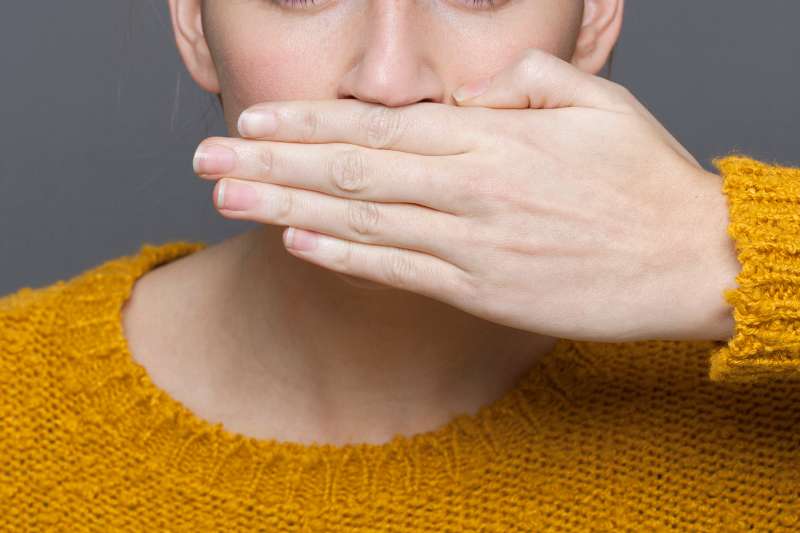 hand covering mouth