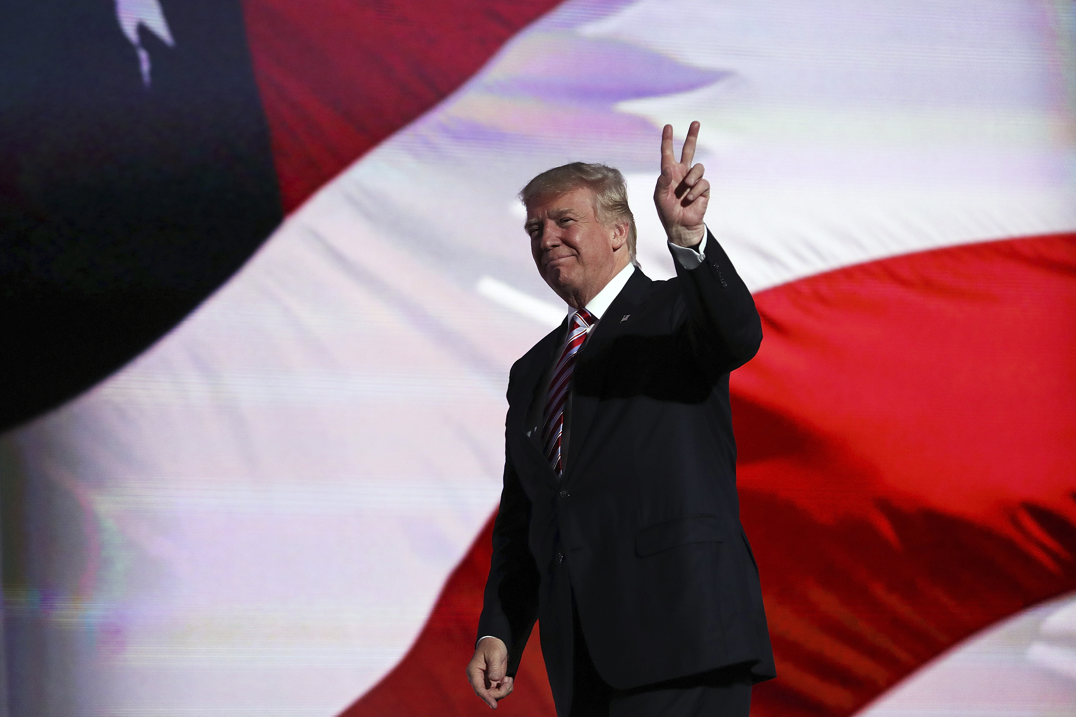 Republican presidential candidate Donald Trump gestures after Republican vice presidential candidate Mike Pence delivered his speech on the third day of the Republican National Convention on July 20, 2016 at the Quicken Loans Arena in Cleveland, Ohio.