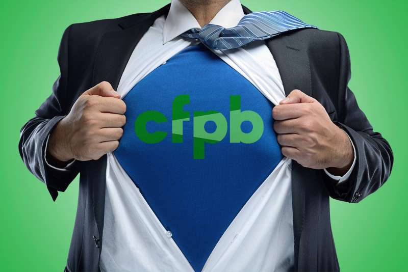 man in business suit showing shirt with CFPB logo