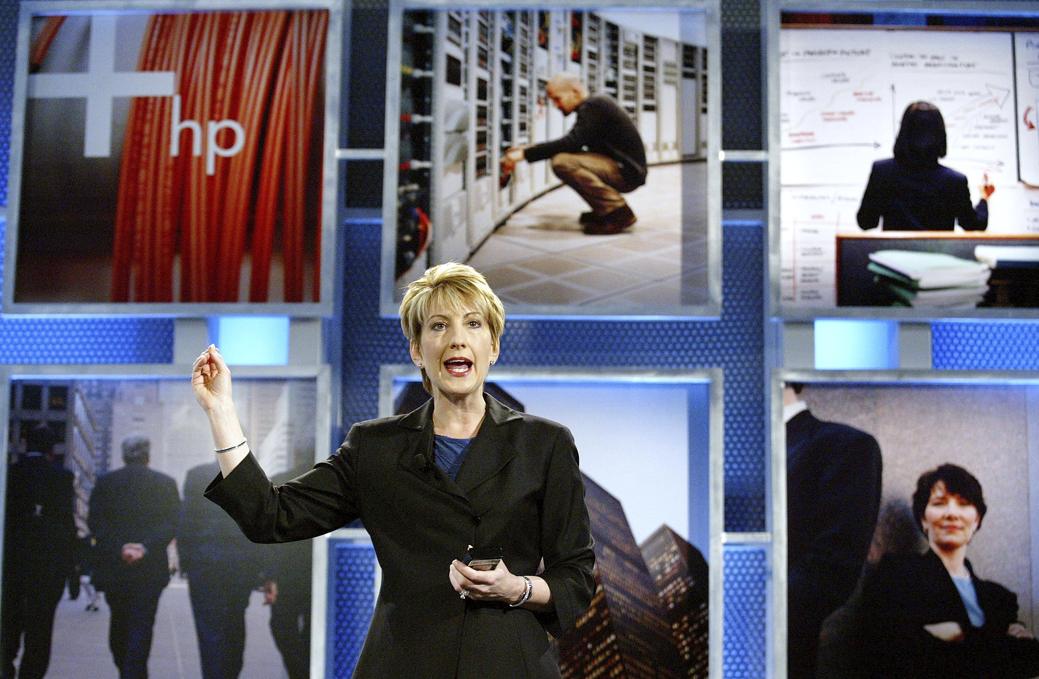 Hewlett-Packard (HP) CEO Carly Fiorina gestures as she speaks at the launch of the HP Adaptive Enterprise Strategy May 6, 2003 in San Jose, California. HP announced new products and services for companies to make their computing systems more adaptive to the changing computer world.