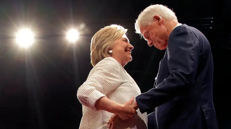 Democratic presidential candidate Hillary Clinton, second from right, greets her husband, former president Bill Clinton during a presidential primary election night rally, June 7, 2016, in New York.