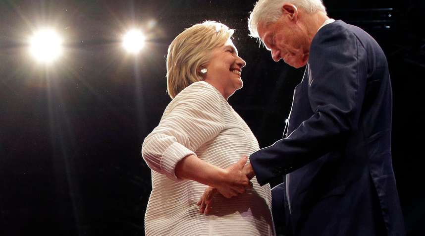 Democratic presidential candidate Hillary Clinton, second from right, greets her husband, former president Bill Clinton during a presidential primary election night rally, June 7, 2016, in New York.