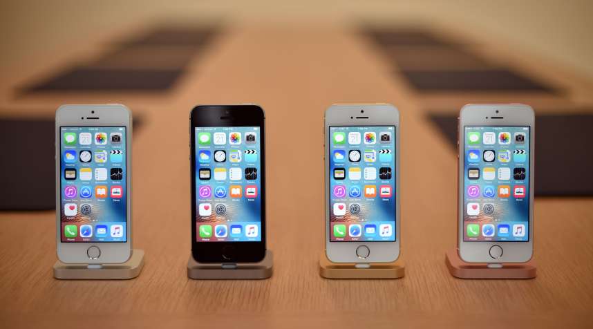 A set of iPhone SE handsets are seen on display during a media event at Apple headquarters in Cupertino, California on March 21, 2016.