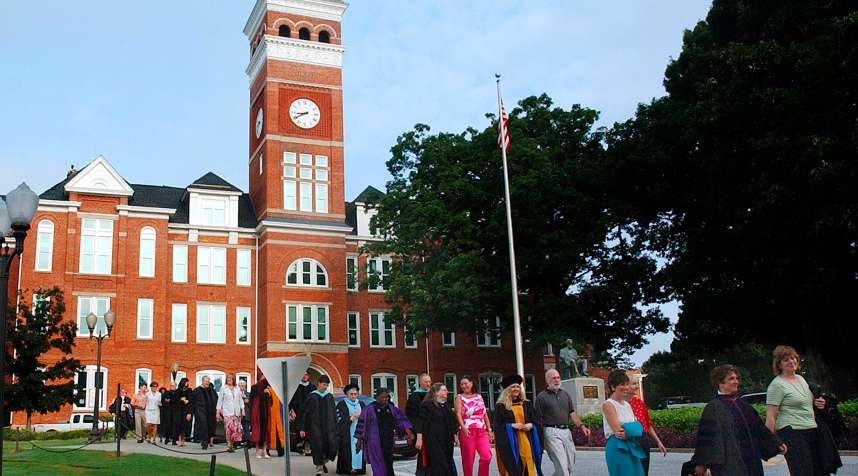 Members of the Clemson University faculty exit Tillman  Hall to lead a procession across campus to mark the beginning of the school's new academic year with the Victor Hurst Convocation ceremony in Clemson S.C. on Aug. 23, 2005.